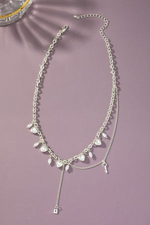 Asymmetric necklace with puffy heart drops